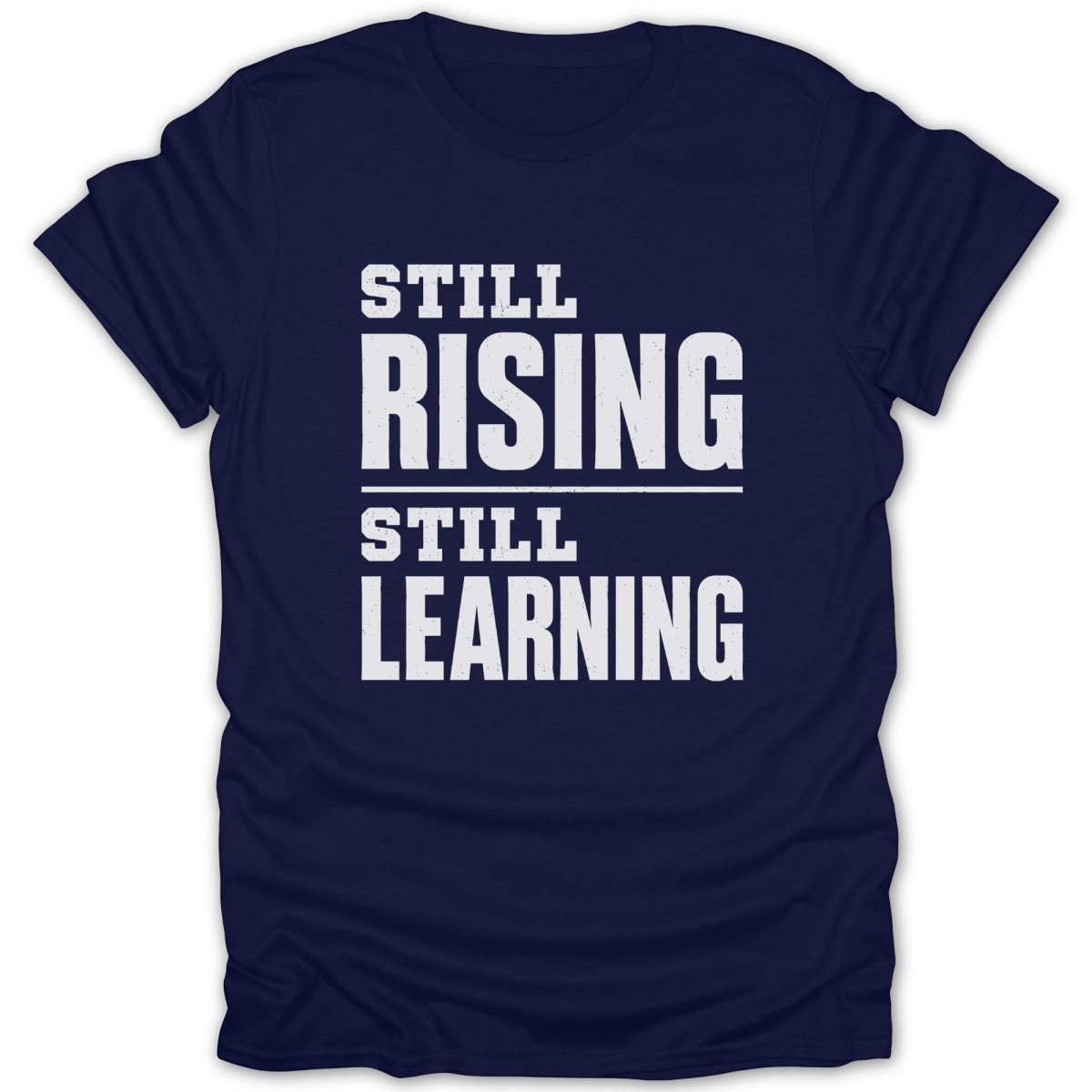 Navy t-shirt with white text reading "STILL RISING STILL LEARNING".