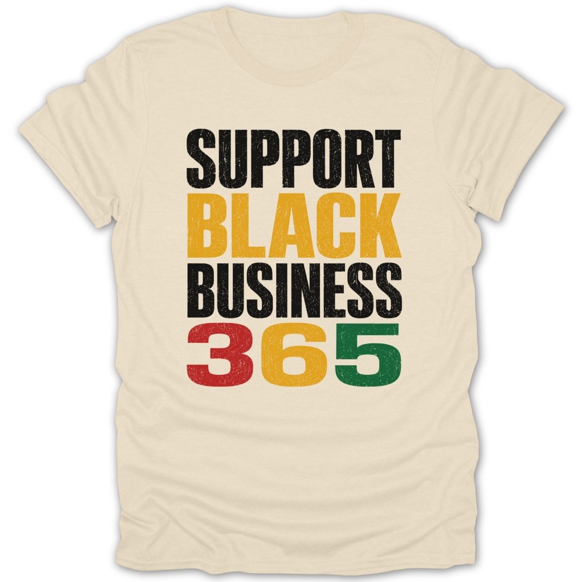 Light cream t-shirt with text "SUPPORT BLACK BUSINESS 365" in black, gold, red, and green.