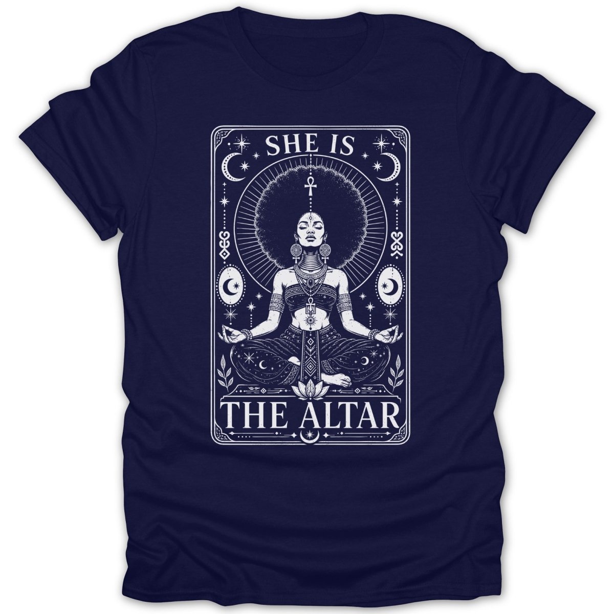 T-shirt graphic with woman meditating, celestial elements, and text "SHE IS THE ALTAR".