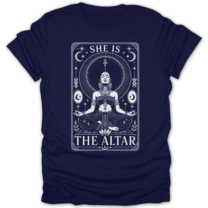T-shirt graphic with woman meditating, celestial elements, and text "SHE IS THE ALTAR".