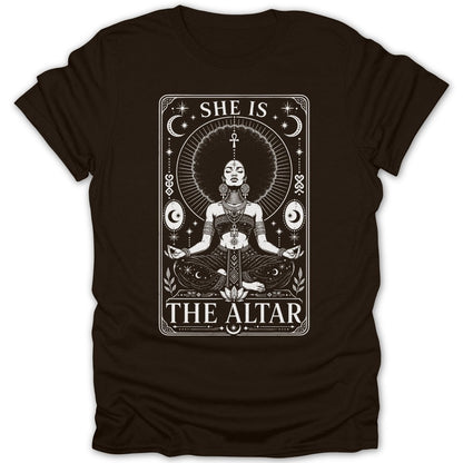 Woman meditating with afro hairdo, text "SHE IS THE ALTAR."