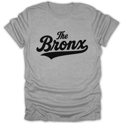 Grey t-shirt with black text "The Bronx" in a cursive font.