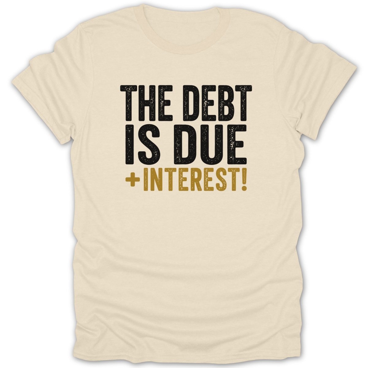 Cream t-shirt with black and gold text reading "THE DEBT IS DUE + INTEREST!"