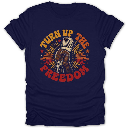 Navy t-shirt with a vintage microphone held by a hand and text "TURN UP THE FREEDOM."