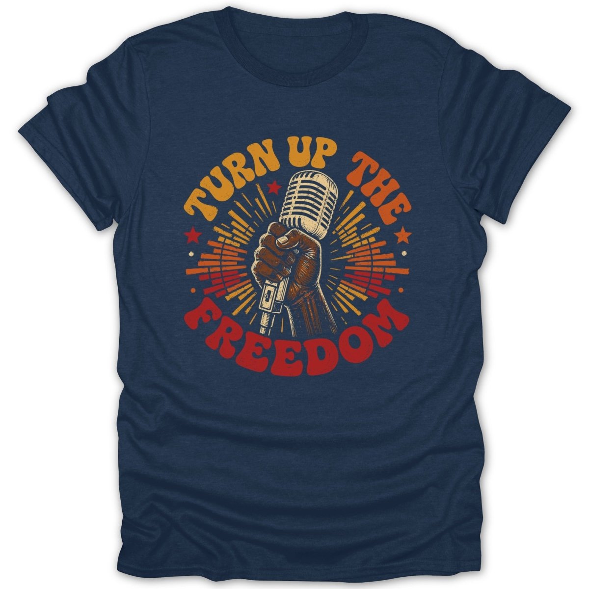 Dark blue t-shirt with a vintage microphone held by a fist and text "Turn Up the Freedom".