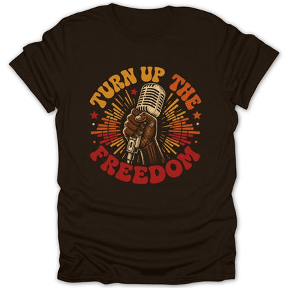 Brown t-shirt with hand holding vintage microphone and text "Turn Up The Freedom".
