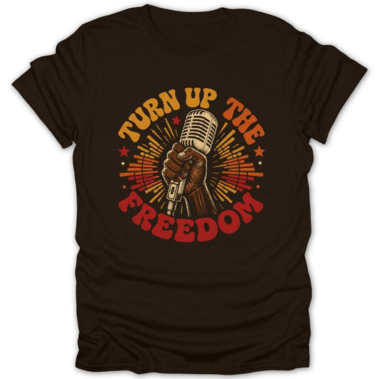 Brown t-shirt with hand holding vintage microphone and text "Turn Up The Freedom".
