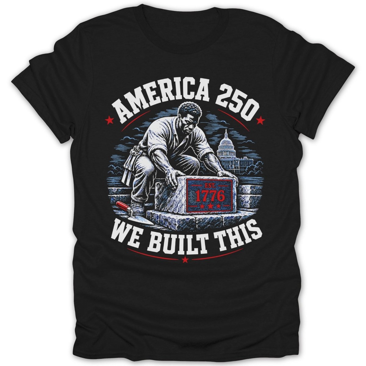 Black t-shirt graphic with man laying stone labeled "EST. 1776", texts "AMERICA 250" and "WE BUILT THIS".