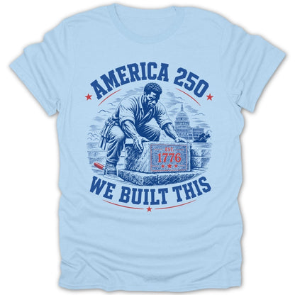 T-shirt with a graphic of a man building the US Capitol, reads "America 250 We Built This Est 1776".