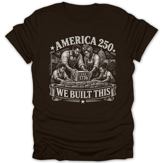 Black t-shirt with a family building bricks, "America 250" and "We Built This."