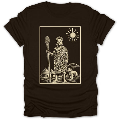 T-shirt graphic: child king with staff, hut, lion, tree, and sun.